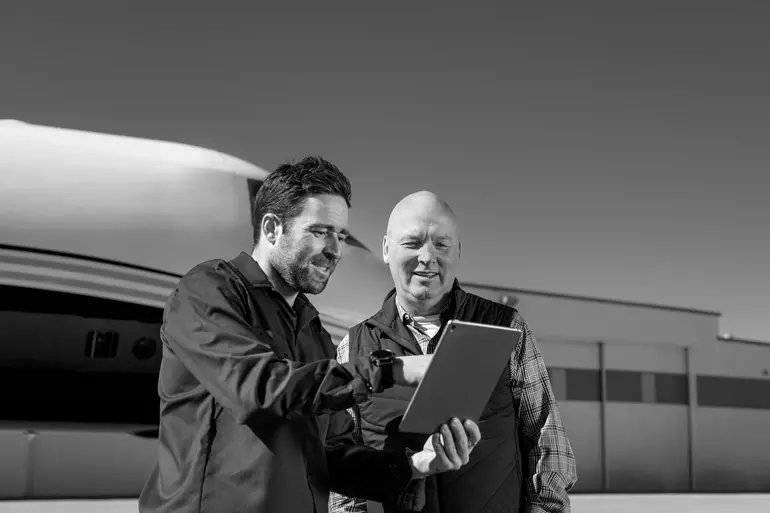 2 QSP asscociates talking and checking a document